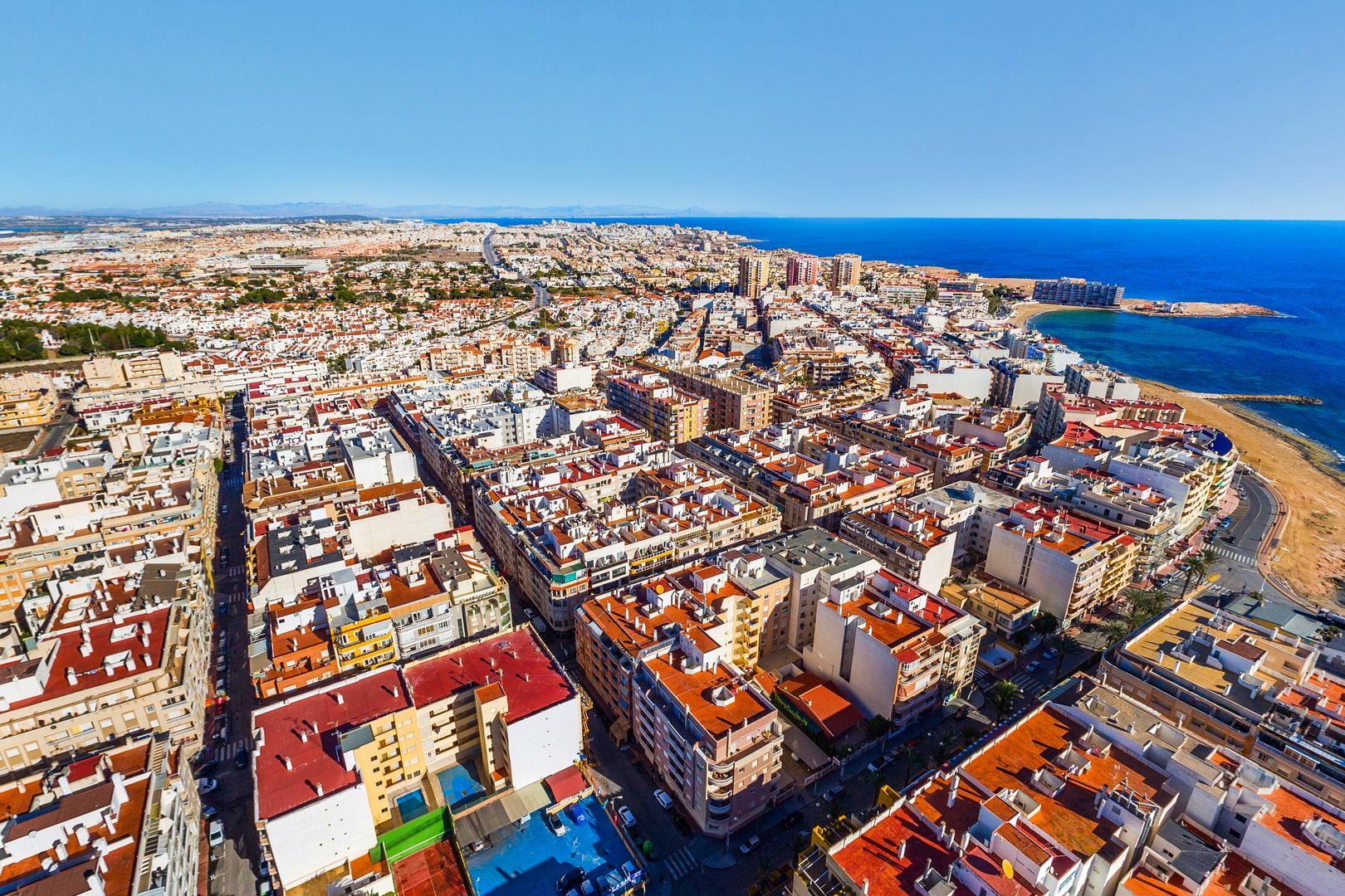 Playa Los Locos beach aerial view Torrevieja rocky coves